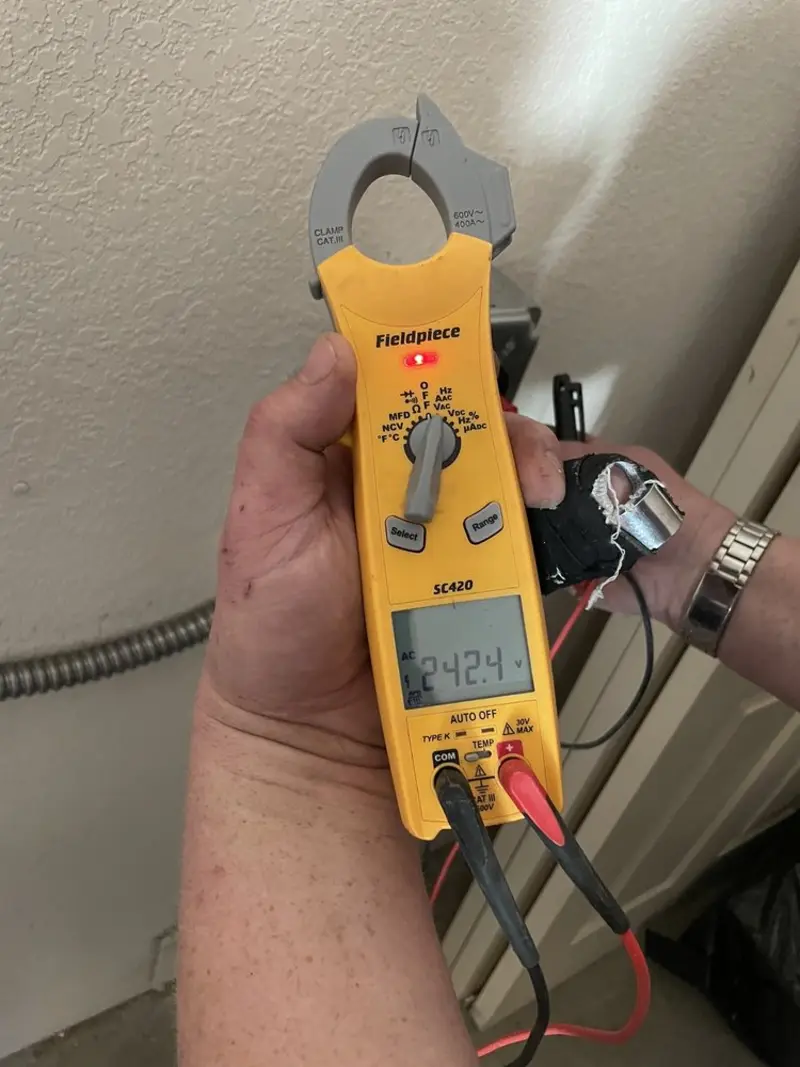 Voltage testing with clamp meter during Ceiling Fan Installation in Spring Hill
